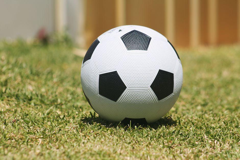 western soccer ball on green grass
